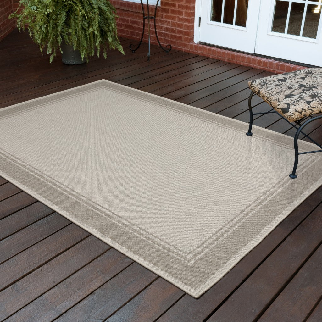 HomeRoots 5’ x 7’ Ivory and Gray Bordered Indoor Outdoor Area Rug
