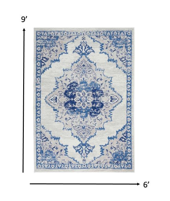 HomeRoots 6' x 9' Ivory and Blue Medallion Area Rug