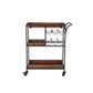 Benzara UPT-276565 30" Brown and Black Handcrafted Mango Wood Bar Serving Cart with Caster Wheels, 6 Bottle Holders, and Tray Shelves