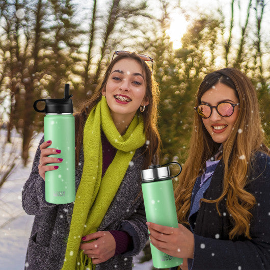https://kitchenoasis.com/cdn/shop/files/Costway-22-Oz-Green-Double-walled-Insulated-Stainless-Steel-Water-Bottle-with-2-Lids-and-Straw-2.jpg?v=1702430999&width=1445