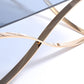 HomeRoots 14" Smoked Glass and Rosegold Stainless Steel Coffee Table