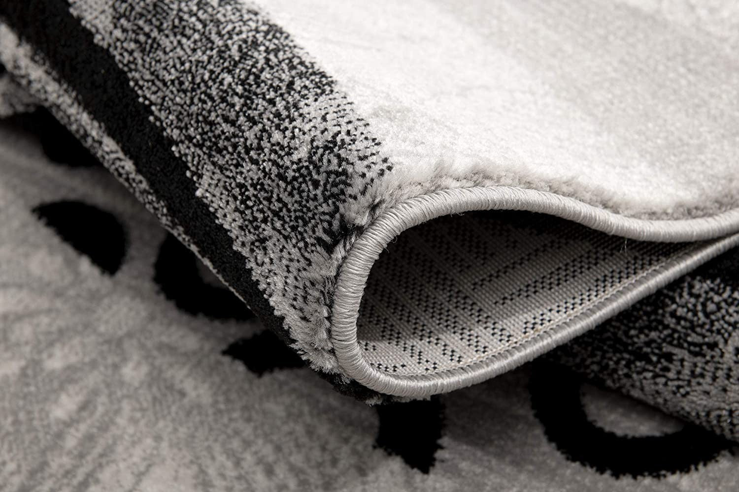 HomeRoots 2' x 13' Gray and Black Abstract Waves Runner Rug