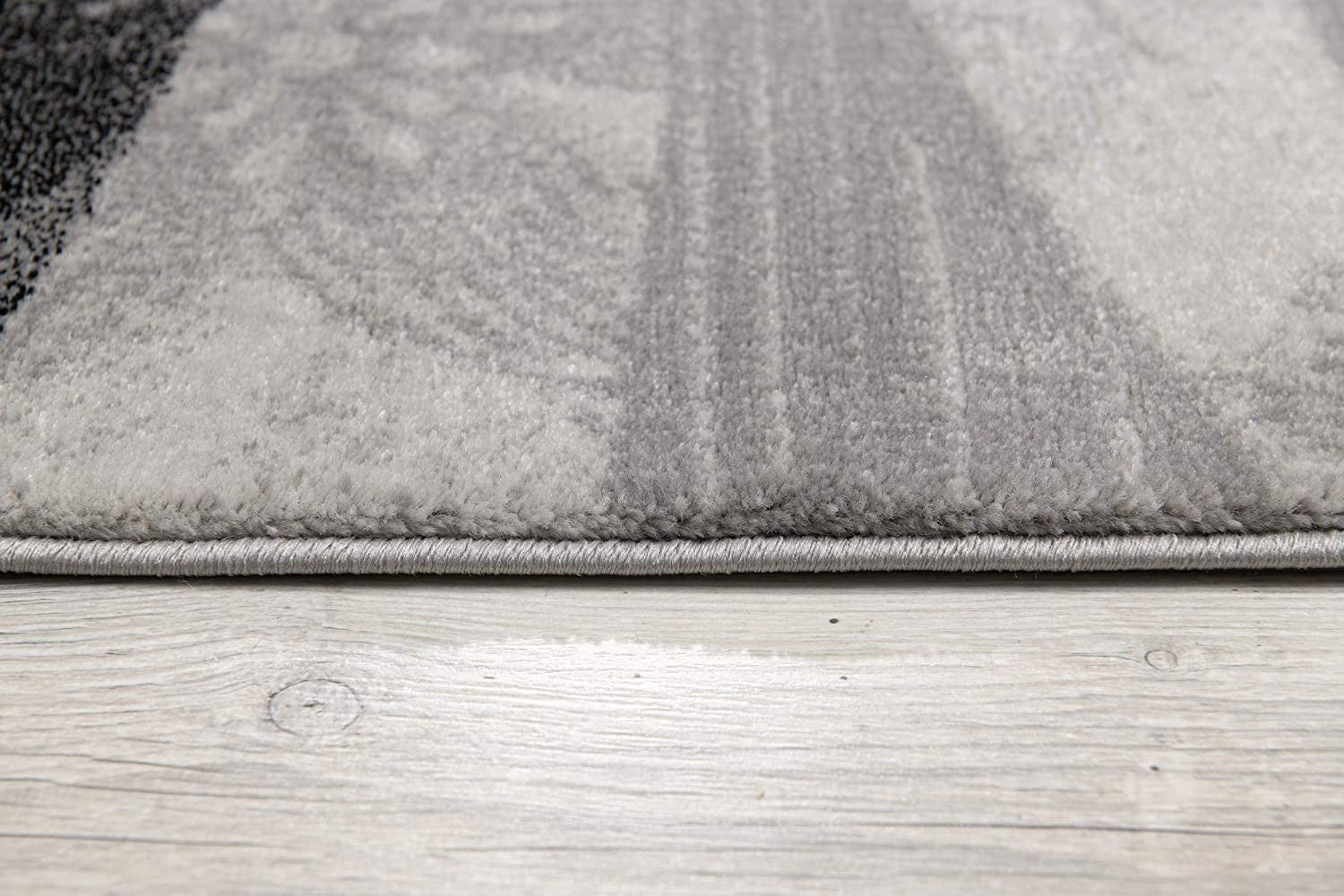 HomeRoots 2' x 13' Gray and Black Abstract Waves Runner Rug