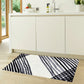 HomeRoots 2' x 4' Black and Gray Abstract Arrow Washable Floor Mat