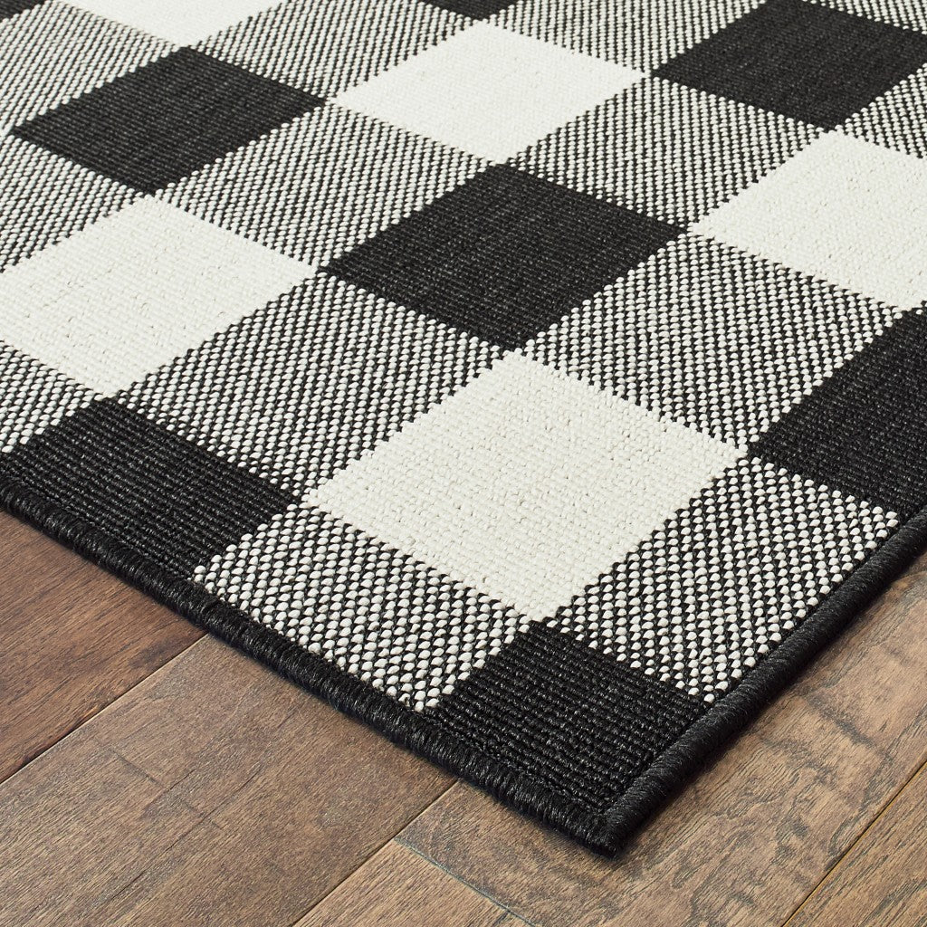 HomeRoots 2’ x 4’ Black and Ivory Gingham Indoor Outdoor Area Rug