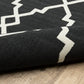 HomeRoots 2’ x 4’ Black and Ivory Trellis Indoor Outdoor Area Rug