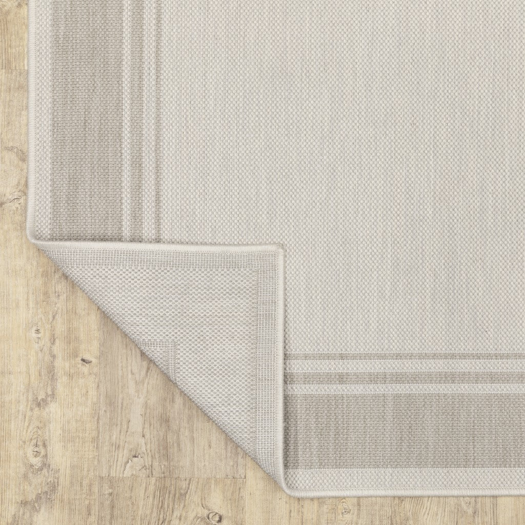 HomeRoots 2' x 7' Ivory and Gray Bordered Indoor Outdoor Runner Rug