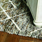HomeRoots 2' x 7' Mocha Geometric Diamond Runner Rug with Fringe