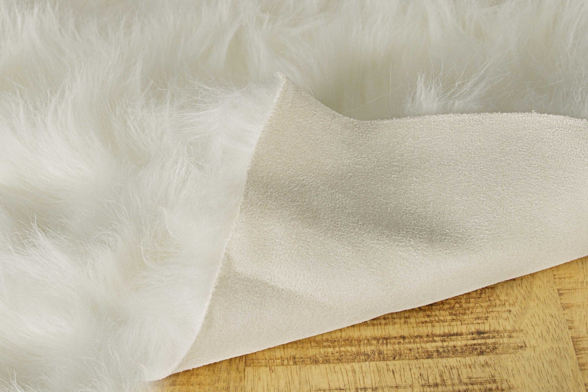 HomeRoots 24" x 36" x 1.5" Faux Rectangular Area Rug in Off White Finish