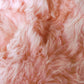 HomeRoots 24" x 36" x 1.5" Single Sheepskin Area Rug in Pink Finish