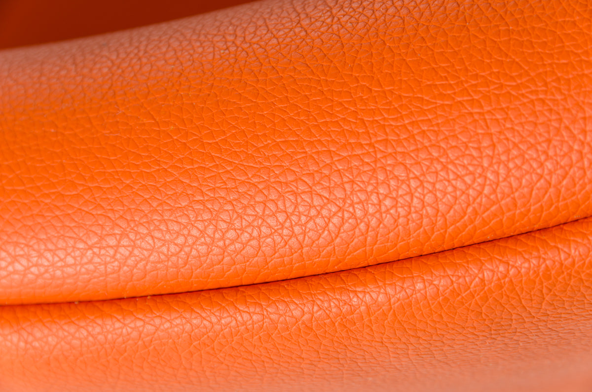 HomeRoots 28" Leatherette and Metal Accent Chair in Orange Finish
