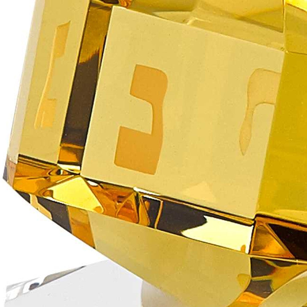 HomeRoots 3 Mouth Blown Amber Dreidel On Crystal Stand