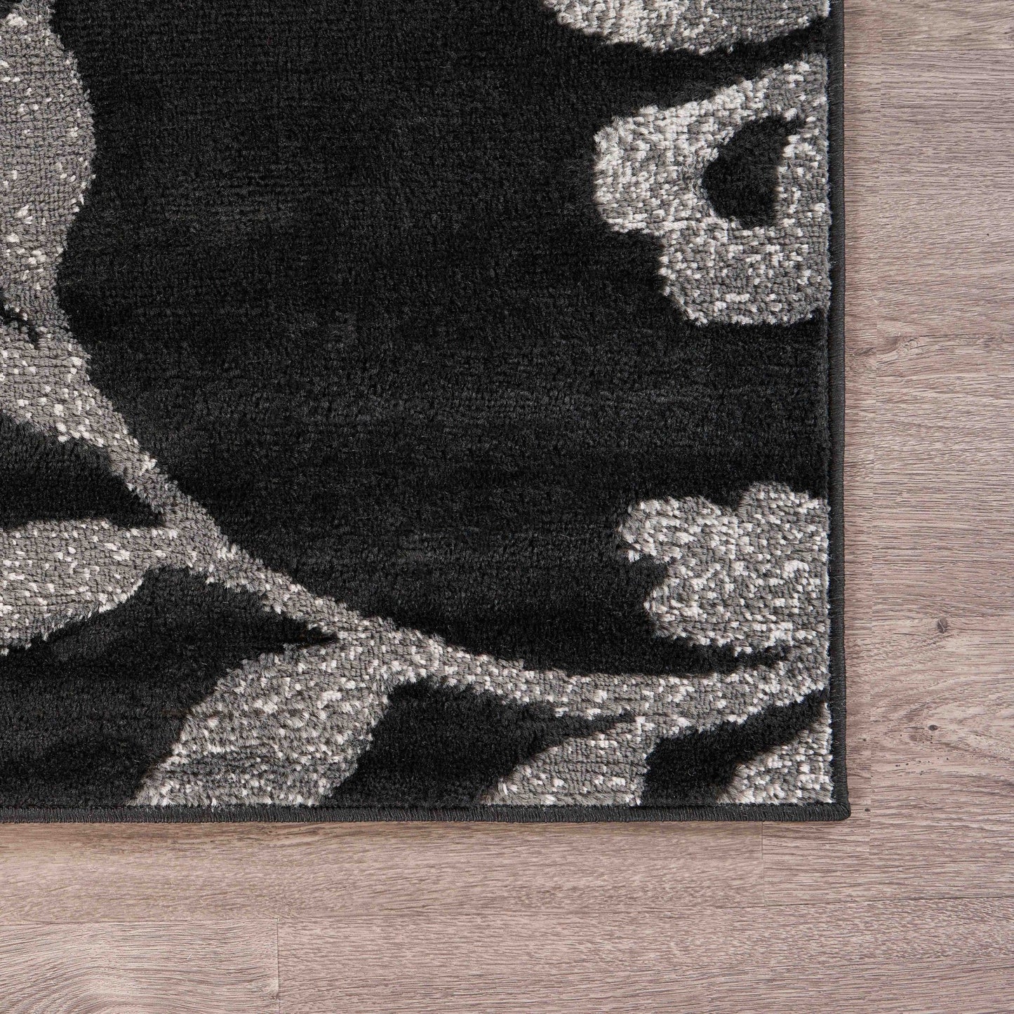 HomeRoots 5’ x 7’ Black Filigree Vines Area Rug