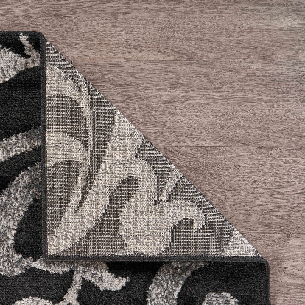 HomeRoots 5’ x 7’ Black Filigree Vines Area Rug
