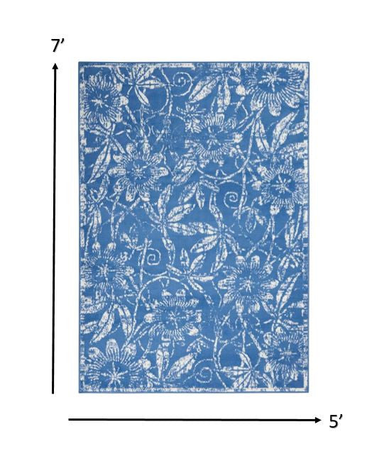 HomeRoots 5’ x 7’ Blue Area Rug With Ivory Floral Vines Finish