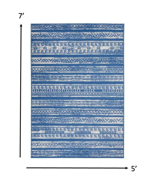 HomeRoots 5’ x 7’ Distressed Area Rug in Light Blue and Ivory Finish