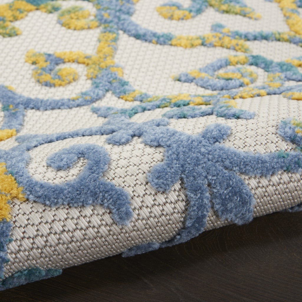 HomeRoots 5’ x 7’ Ivory and Blue Indoor Outdoor Area Rug