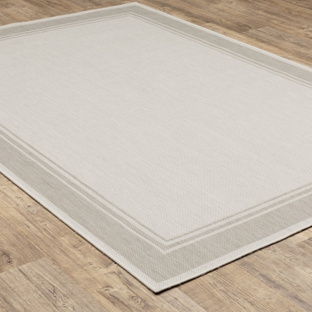 HomeRoots 5’ x 7’ Ivory and Gray Bordered Indoor Outdoor Area Rug