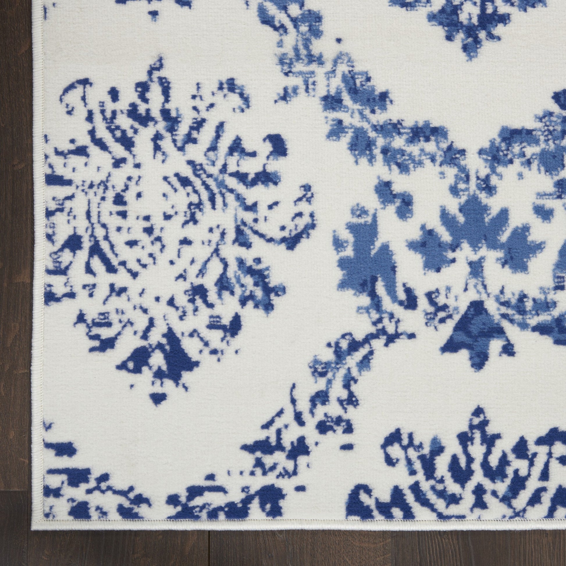 HomeRoots 5’ x 7’ Ivory and Navy Damask Area Rug