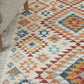 HomeRoots 5’ x 7’ Ivory and Red Diamonds Area Rug