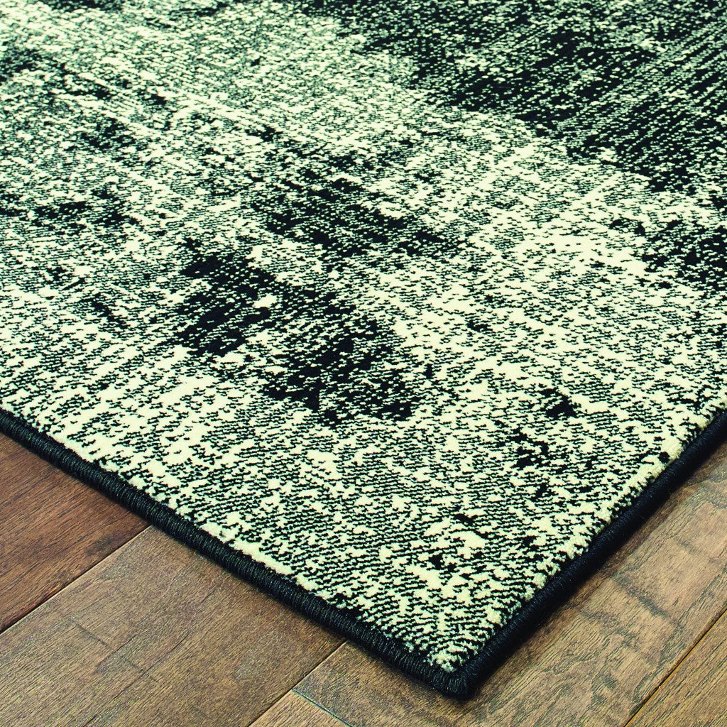 HomeRoots 5' x 8' Black Ivory Machine Woven Abstract Indoor Area Rug