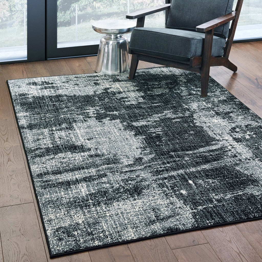 HomeRoots 5' x 8' Black Ivory Machine Woven Abstract Indoor Area Rug