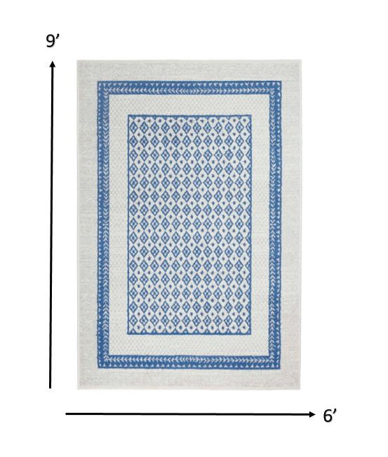 HomeRoots 6' x 9' Ivory and Blue Geometric Area Rug