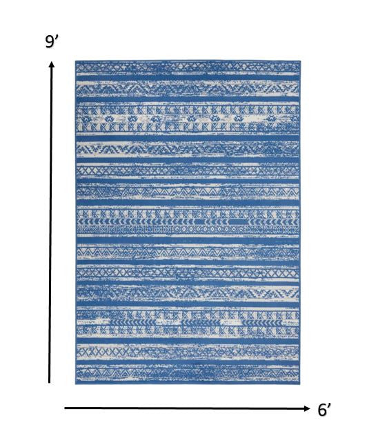 HomeRoots 6' x 9' Light Blue and Ivory Distressed Area Rug