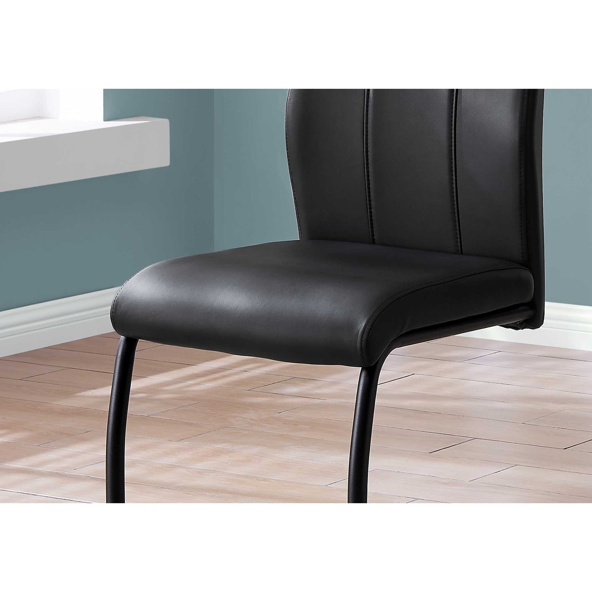 HomeRoots 77.5" Black Leather Look Chrome Metal And Foam Dining Chairs in Set of Two