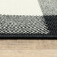 HomeRoots 8’ Round Black and Ivory Gingham Indoor Outdoor Area Rug