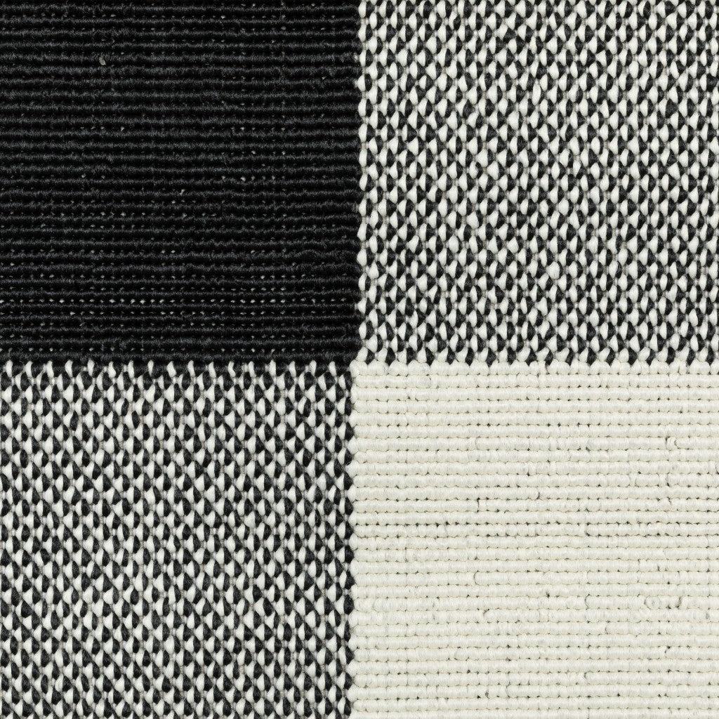 HomeRoots 8’ Round Black and Ivory Gingham Indoor Outdoor Area Rug