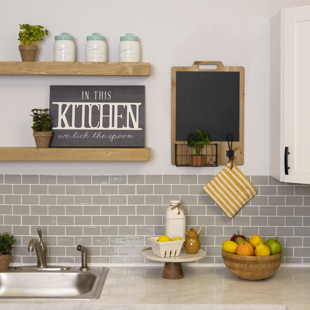 HomeRoots In This Kitchen We Lick The Spoon Wall Art
