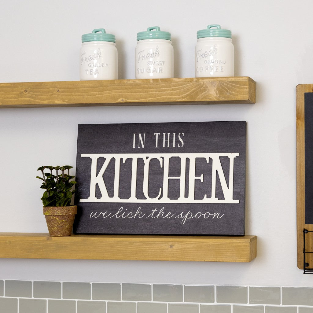 HomeRoots In This Kitchen We Lick The Spoon Wall Art