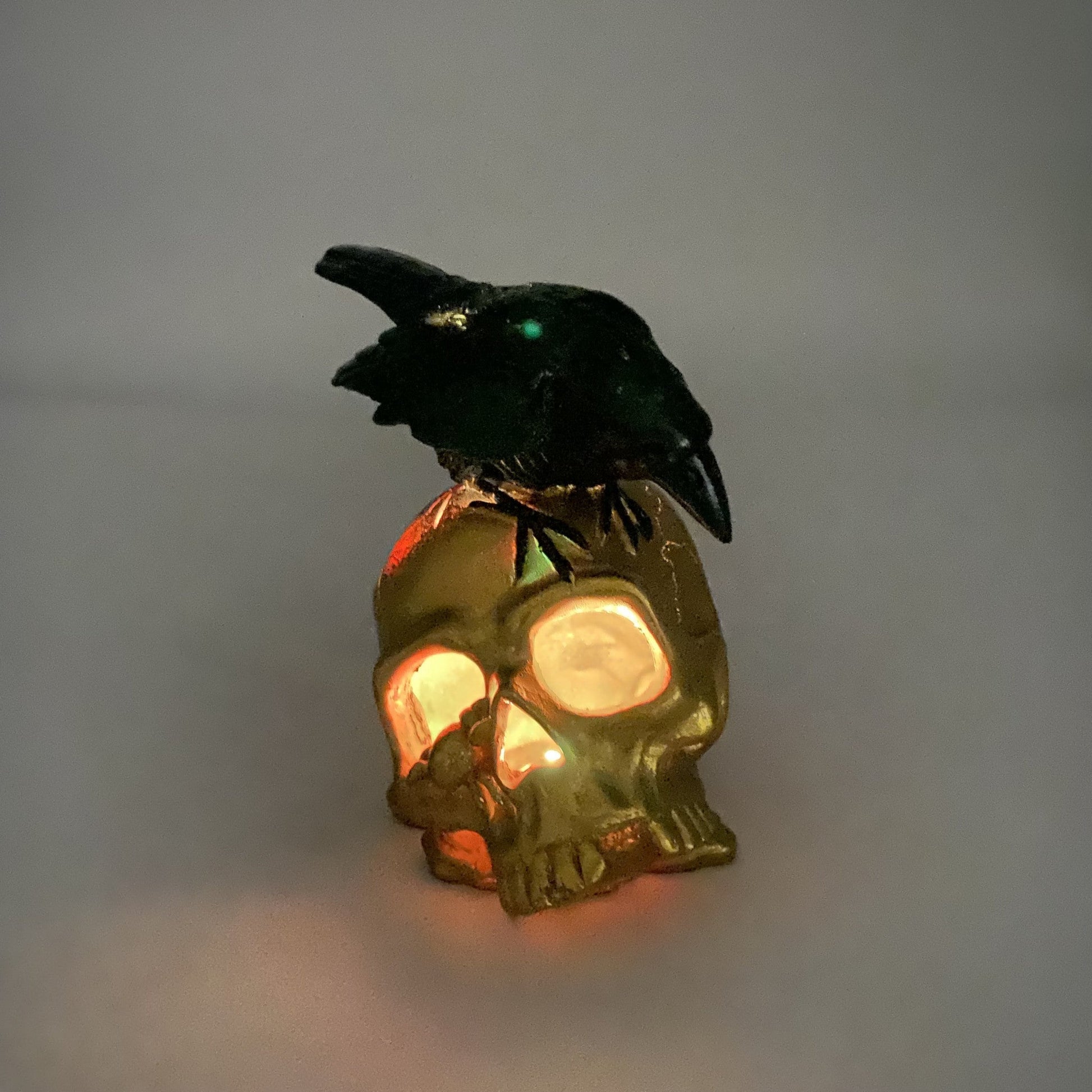 HomeRoots LED Gold Skull and Black Crow Sculpture