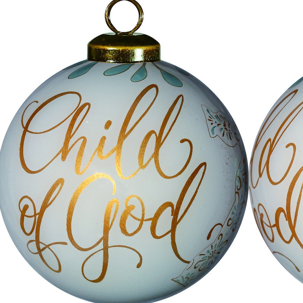 HomeRoots White and Gold Child of God Hand Painted Mouth Blown Glass Ornament