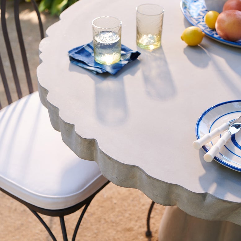 Made Goods Grady 48" x 30" Light Gray Reconstituted Stone Dinning Table With Round Scalloped Table Top