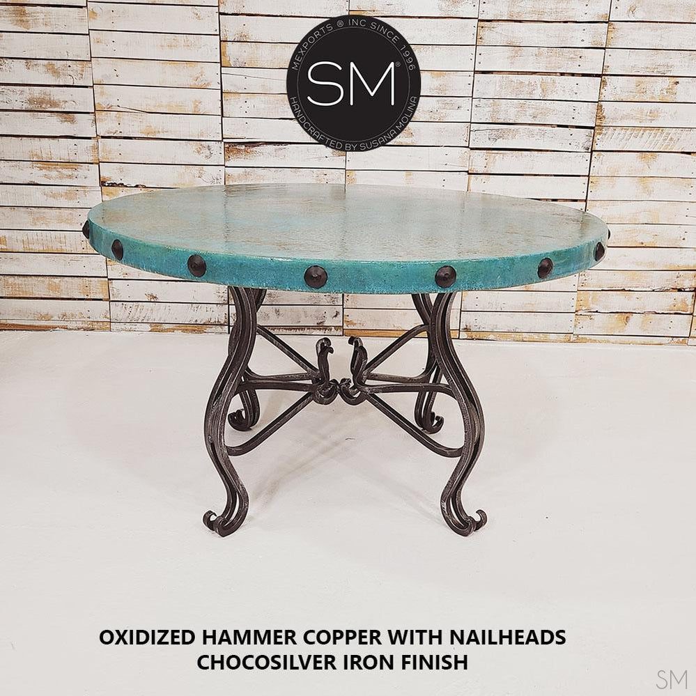 Mexports by Susana Molina 48" x 30" Oxidized Hammer Copper Top With Nailheads and 4-Leg Iron Base Round Dining Table