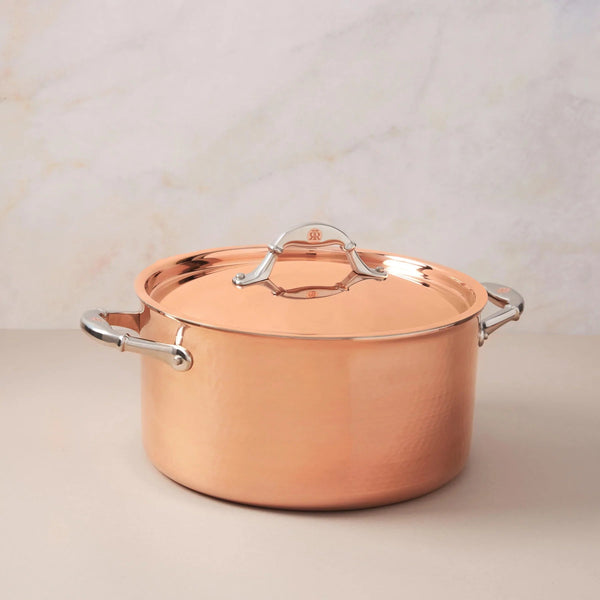 https://kitchenoasis.com/cdn/shop/files/Ruffoni-Symphoria-Cupra-10-8-Quart-Hammered-Copper-Stock-Pot-With-Copper-Clad-Lid-and-Riveted-Stainless-Steel-Handle-Inlaid-With-Signature-Copper-Coin_grande.webp?v=1685838909