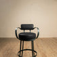 Stone County Ironworks Cedarvale 25" Chalk White Swivel Iron Bar Stool With Back, Arms and Umber Leather Upholstery