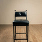 Stone County Ironworks Forest Hill 25" Hand Rubbed Pewter Iron Bar Stool With Gold Iron Accent, Padded Back and Black Leather Upholstery